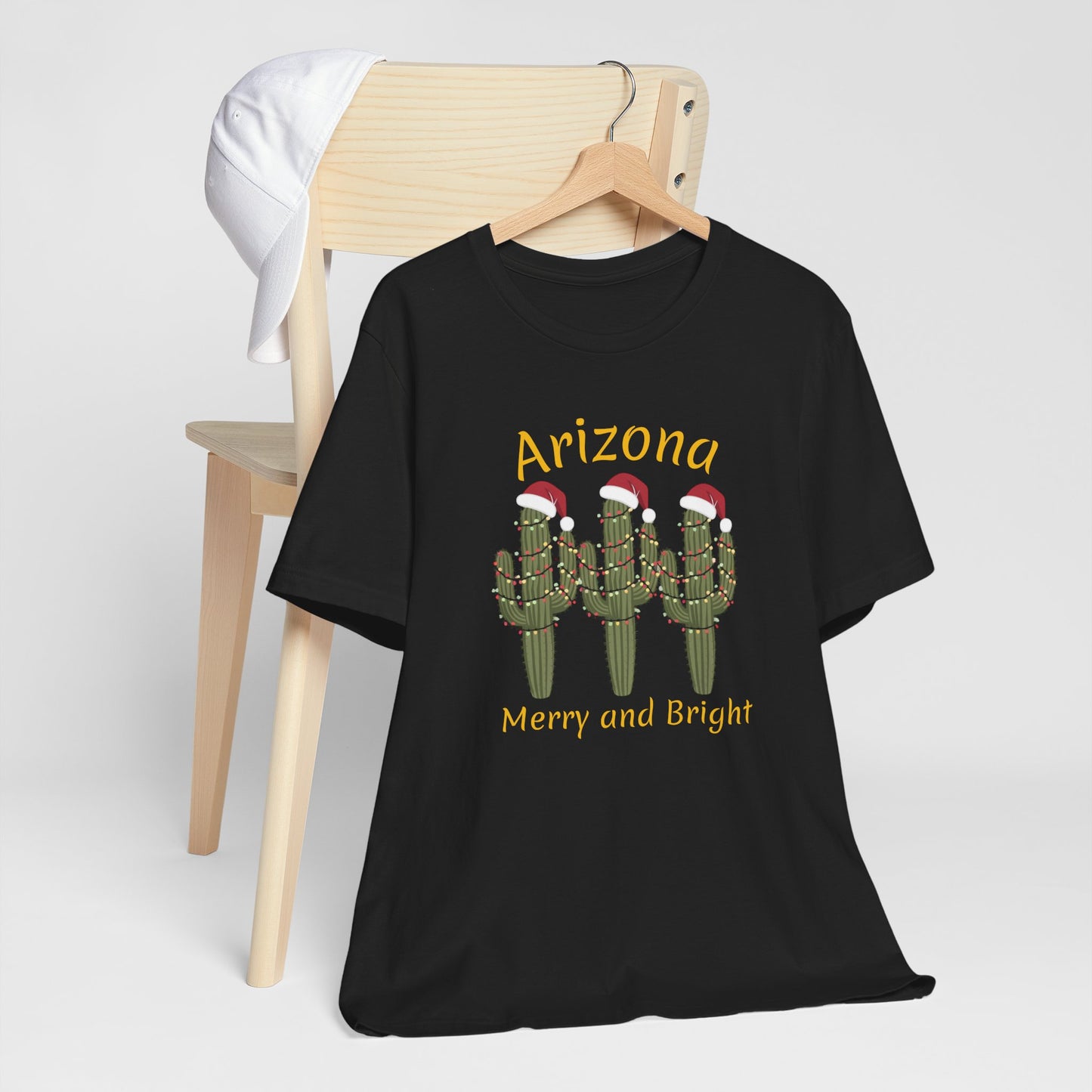 Arizona Christmas Saguaro cactus with festive lights and Santa caps, Unisex Cactus Tee, Holiday souvenir