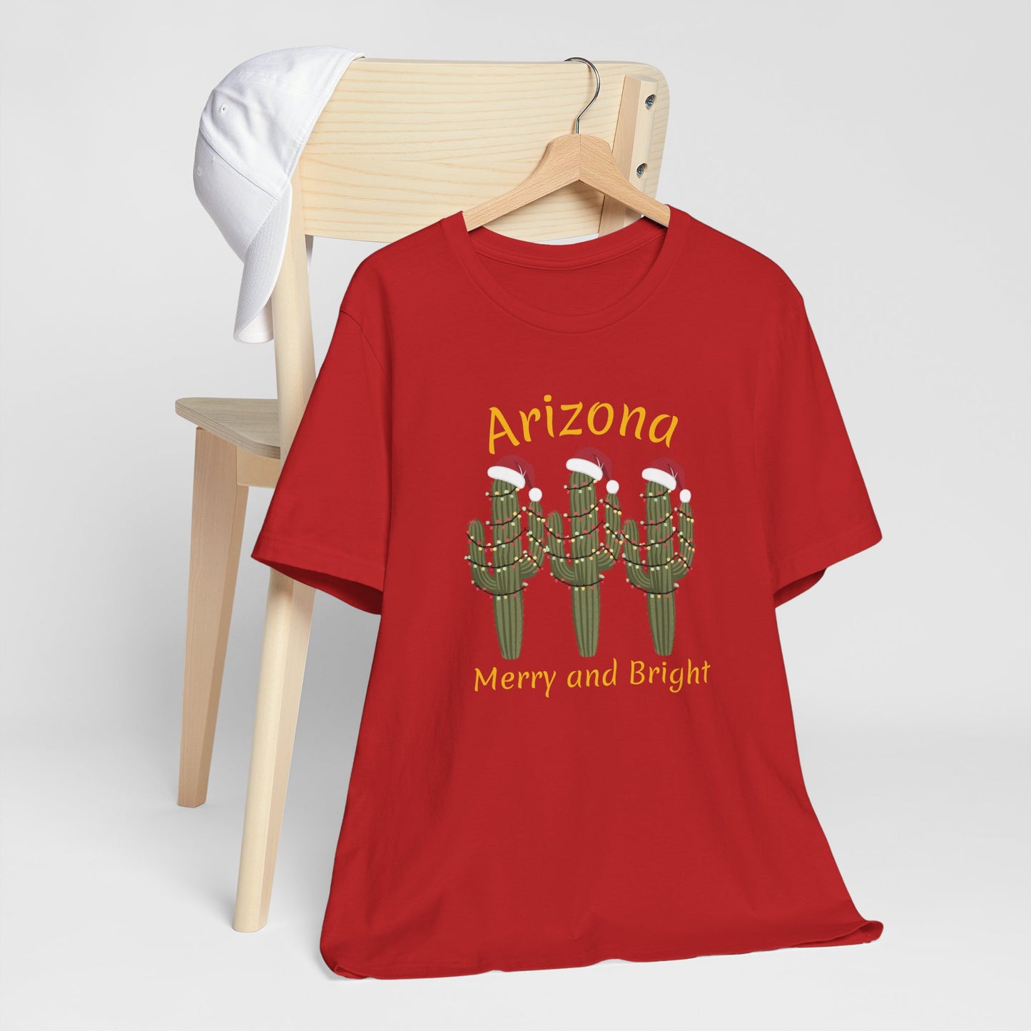 Arizona Christmas Saguaro cactus with festive lights and Santa caps, Unisex Cactus Tee, Holiday souvenir