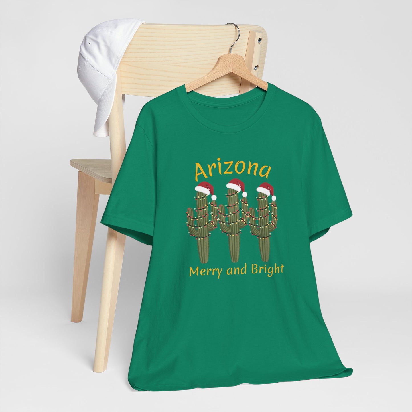 Arizona Christmas Saguaro cactus with festive lights and Santa caps, Unisex Cactus Tee, Holiday souvenir
