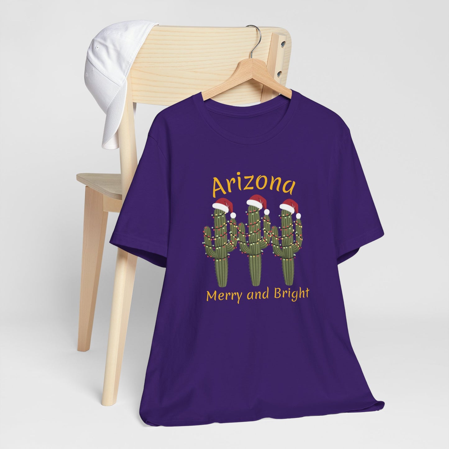 Arizona Christmas Saguaro cactus with festive lights and Santa caps, Unisex Cactus Tee, Holiday souvenir